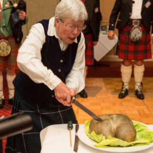 Woman cutting meat