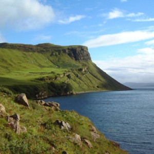 A large mountain next to water